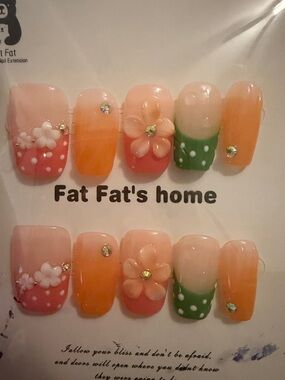 Pink, orange, and green polka dot handmade acrylics press ons with 3d flower